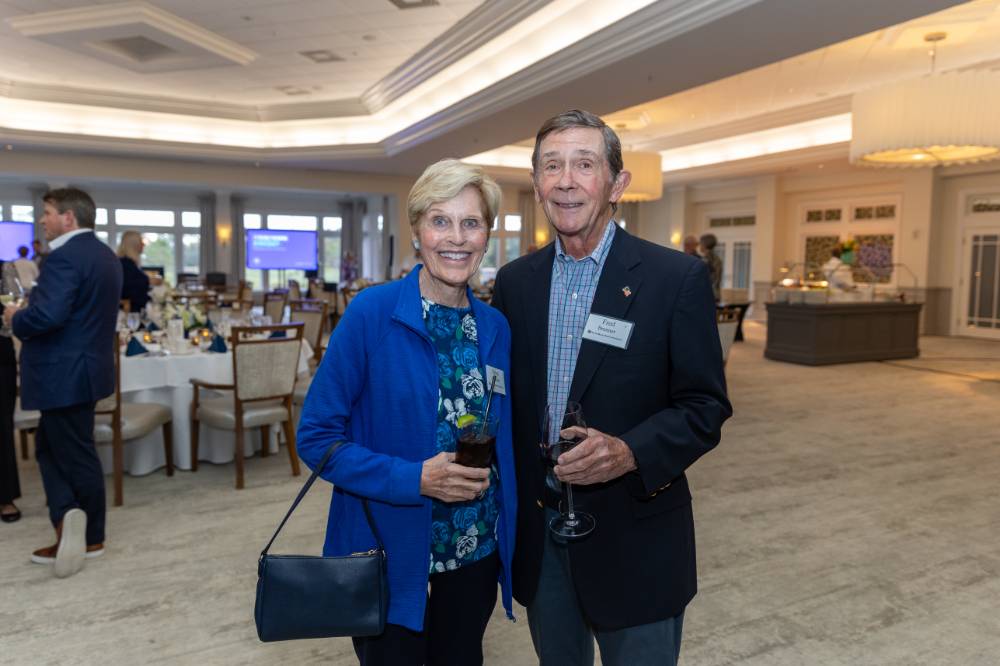 Fred and Helen Brenner standing and smiling for camera